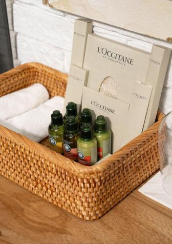 a basket with essential oils and towels on a table at Shakaryan Rancho&Restaurant in Dsegh