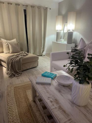a living room with a couch and a coffee table at Southkey House in Repton