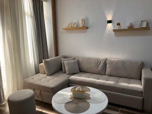 a living room with a couch and a table at Royal Club Residence in Port Ghalib