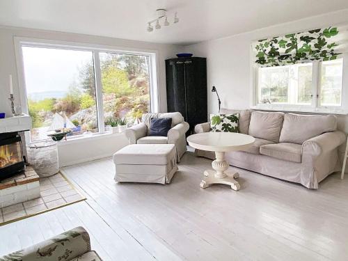 a living room with a couch and a table at 6 person holiday home in Åskloster-By Traum in Åskloster