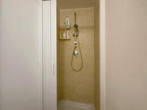 a bathroom with a shower with a toilet and a sink at Home AGM in Pozzallo