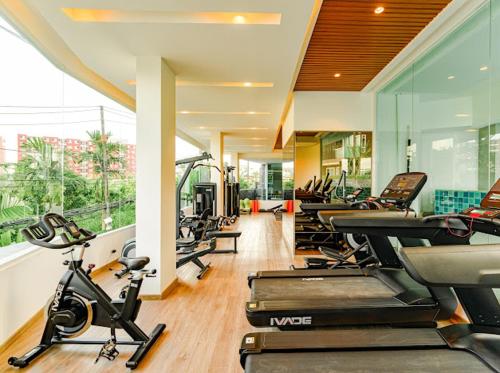 a gym with a bunch of exercise bikes in it at 2BR Luxury Condo The City Phuket in Ban Ket Ho