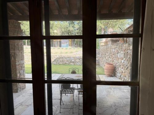 a view through a window of a patio at Agriturismo Amici Miei in Marliano