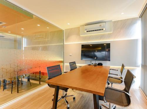 a conference room with a wooden table and chairs at 2BR Luxury Condo The City Phuket in Ban Ket Ho