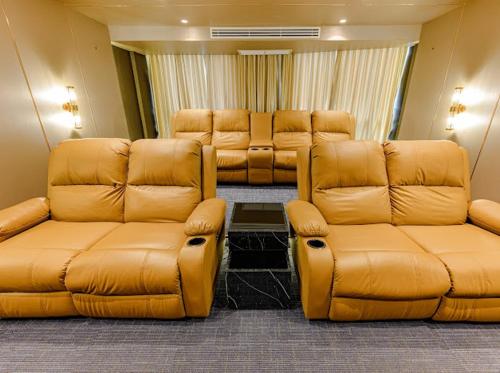 a waiting room with leather chairs and couches at 2BR Luxury Condo The City Phuket in Ban Ket Ho