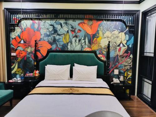 Ένα ή περισσότερα κρεβάτια σε δωμάτιο στο GRAND HOTEL Trịnh Văn Bô
