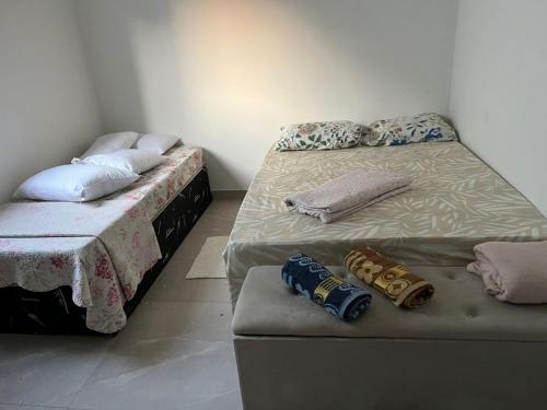 Un ou plusieurs lits dans un hébergement de l'établissement Casa de alto padrão com hidromassagem aquecida aceita pet perto da praia