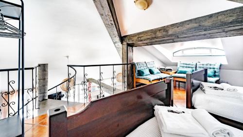 a room with a staircase and a living room at Casa das Arcadas in Angra do Heroísmo
