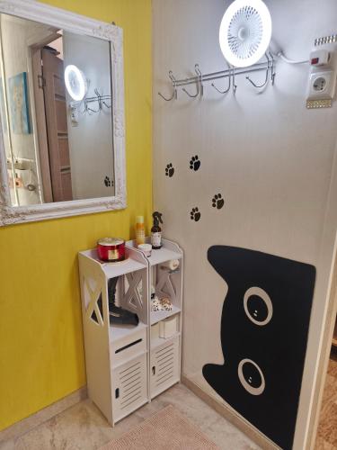 a bathroom with a sink and a mirror at Narva Boho Home in Narva