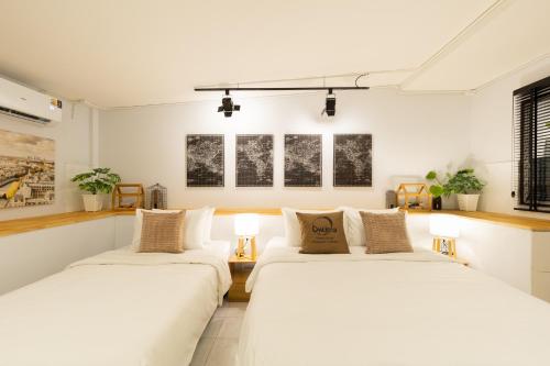 Ένα ή περισσότερα κρεβάτια σε δωμάτιο στο Ombra House No26