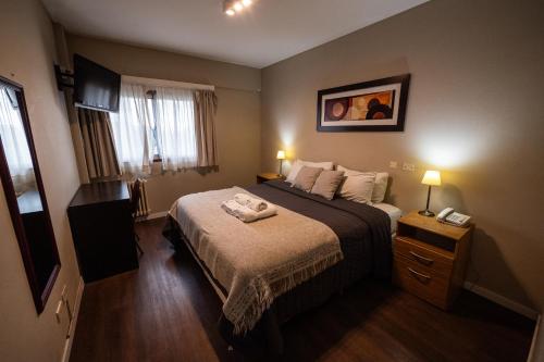 Postel nebo postele na pokoji v ubytování Hotel Aspen Ski by bund