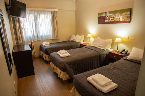 Postel nebo postele na pokoji v ubytování Hotel Aspen Ski by bund