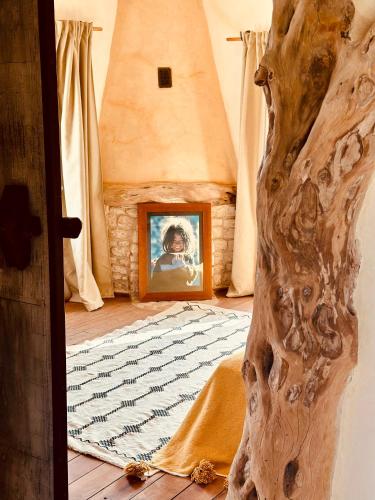 a picture of a person in a room with a rug at Le Hameau des Cascades in Aghnajane