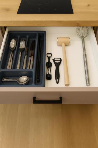 a drawer with utensils and utensils sidx sidx sidx sidx at Apartamenty na Widoku Chłopy in Chłopy