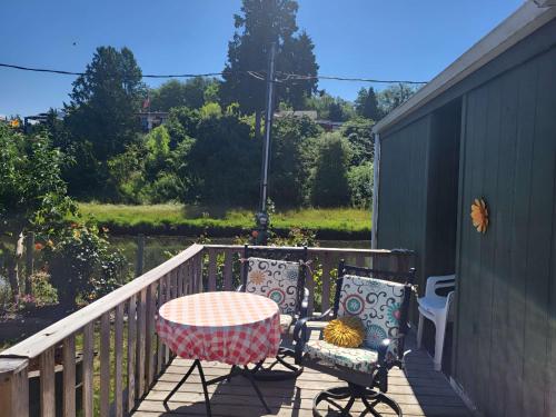a table and two chairs sitting on a deck at Cozy, Private Guest House #5 in Blaine