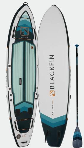 a boat with a paddle and a surfboard at Camper Montenegro and Recreational Vehicles in Budva