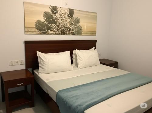 Ένα ή περισσότερα κρεβάτια σε δωμάτιο στο Pousada Caravela