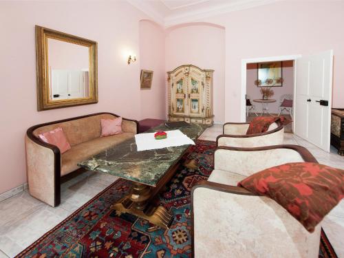 a living room with two couches and a table at Triestewitz Hideaway in Saxony in Arzberg