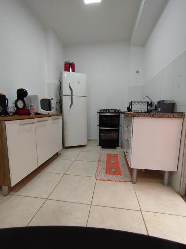 a kitchen with a refrigerator and a stove at Studio Premium in Franca