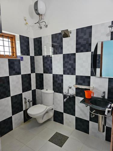 a bathroom with a toilet and a sink at Homestay near Kochi Airport in Ernakulam