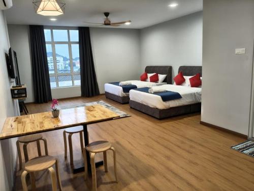 Ένα ή περισσότερα κρεβάτια σε δωμάτιο στο KM Barakah Suite