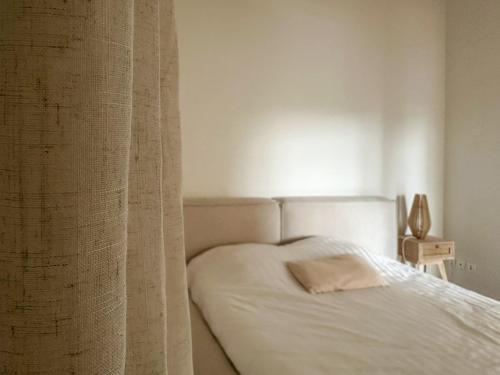 Postel nebo postele na pokoji v ubytování Élégant appartement