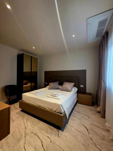 a bedroom with a large bed in a room at HOTEL Mirarti in Rapallo