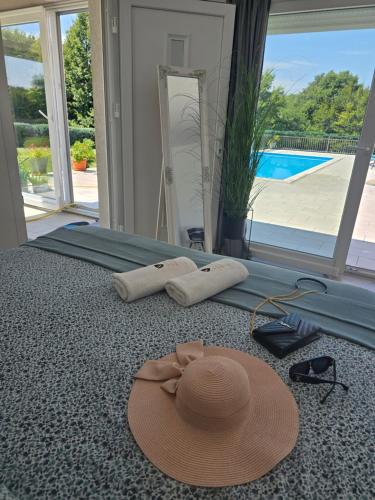 a hat and a pair of glasses and a pair of sunglasses and a pair at Villa Heaven Green in Pazin