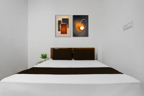 Ένα ή περισσότερα κρεβάτια σε δωμάτιο στο Hotel O Yash Residency