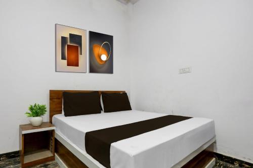 Ένα ή περισσότερα κρεβάτια σε δωμάτιο στο Hotel O Yash Residency