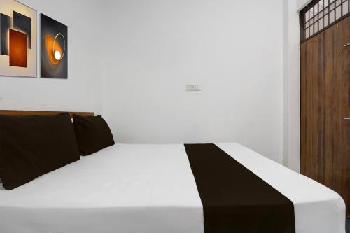 Ένα ή περισσότερα κρεβάτια σε δωμάτιο στο Hotel O Yash Residency