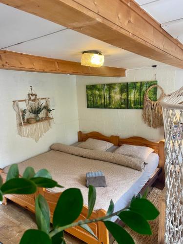 a bedroom with a bed in a room at Private Room in an old Farmhouse near Vaduz in Sevelen