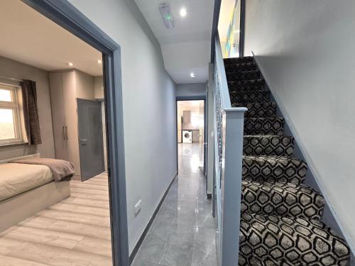 a staircase leading up to a bedroom in a house at Bedroom in shared house in Hounslow in Hounslow