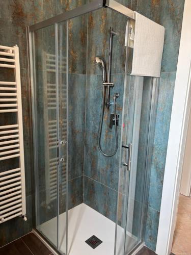 a shower with a glass enclosure in a bathroom at Ai piedi del Morrone in Tocco da Casauria