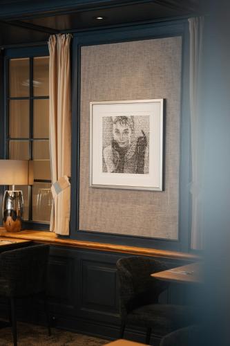 a framed picture of a man on a wall at Ringhotel Niedersachsen in Höxter