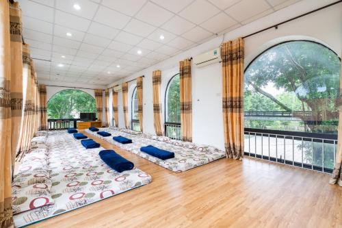 a room with a bunch of pillows on the floor at Lumiere Family Village Ba Vì in Ba Vì
