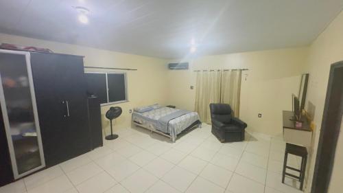 Ένα ή περισσότερα κρεβάτια σε δωμάτιο στο Casa Boaventura COP 30