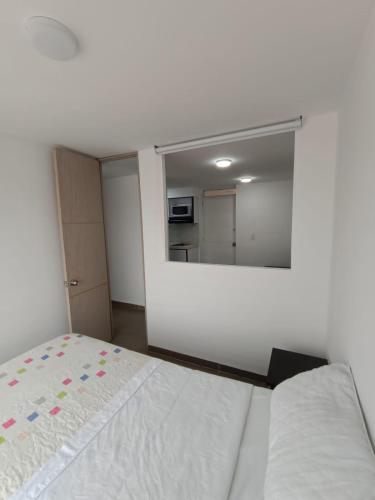 Postel nebo postele na pokoji v ubytování Apartamentos Cardio - Usaquén
