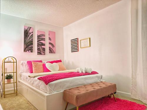 a bedroom with a pink bed with a pink blanket at Christmas 3BR , King and Queen Beds , Uptown Charlotte in Charlotte
