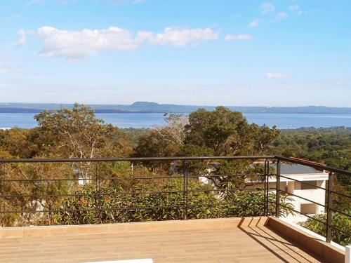 a balcony with a view of the water at Casa Vacacional, Anfiteatro San Bernardino in San Bernardino