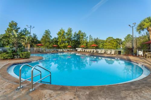 a large swimming pool at a resort at Hilton Vacation Club Grand Beach Orlando in Orlando