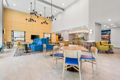 a lobby of a store with tables and chairs at Hampton Inn & Suites Intercourse, Pa in Intercourse