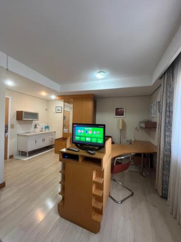 a hospital room with a desk with a computer on it at Hotel Biena Sena Madureira PqIbirapuera Com Garagem 907 in Sao Paulo