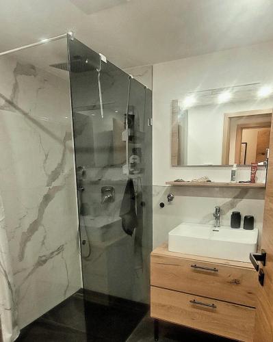a bathroom with a shower and a sink at ALPartement Seefeld in Seefeld in Tirol