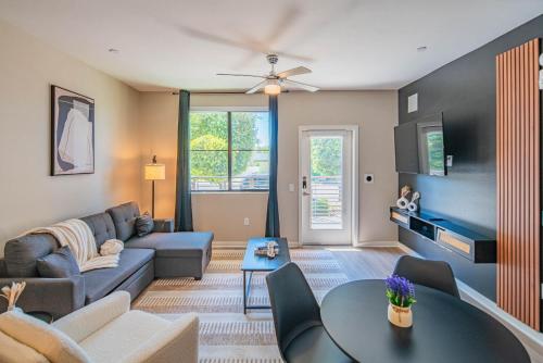 a living room with a couch and a table at Quaint 2BR Uptown Biltmore Gym Pool Parking WD in Phoenix
