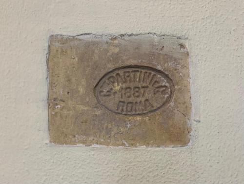 a metal plaque on a wall with the words congratulations happy hour at Colosseum's Custodian - Apartment 115 m2 in Rome