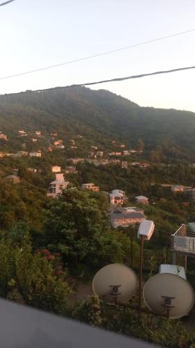 a view of a city with a mountain at Ramgon in Gonio