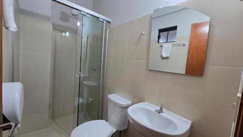 a bathroom with a shower and a toilet and a sink at Rd hotel in Colonia Felicidad
