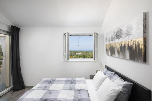 Ένα ή περισσότερα κρεβάτια σε δωμάτιο στο Villa Euphoria Mit Pool, Sauna Und Whirlpool