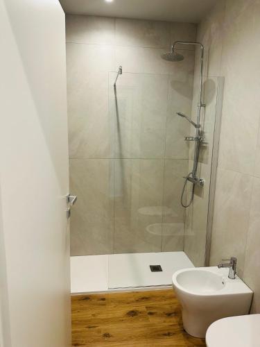 a bathroom with a shower and a toilet and a sink at Stelle di Verona - Rigel in Verona
